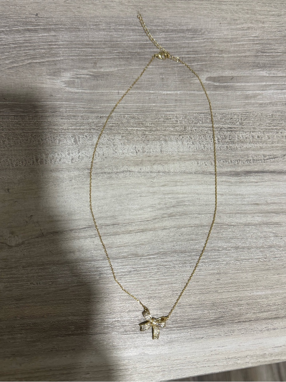 Marshalls Gold Bow Pendant Necklace with Rhinestones
